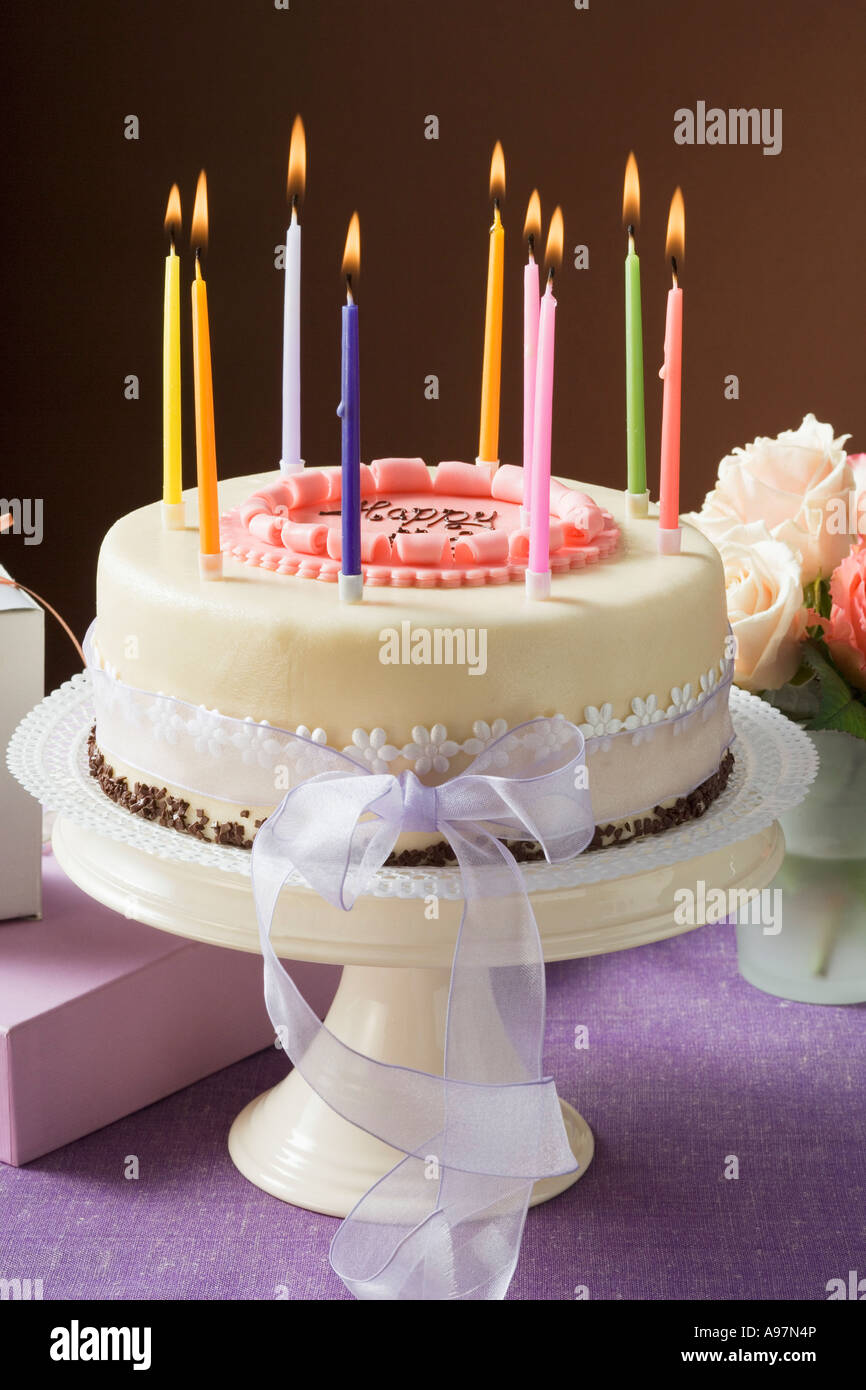 Birthday cake with burning candles FoodCollection Stock Photo - Alamy