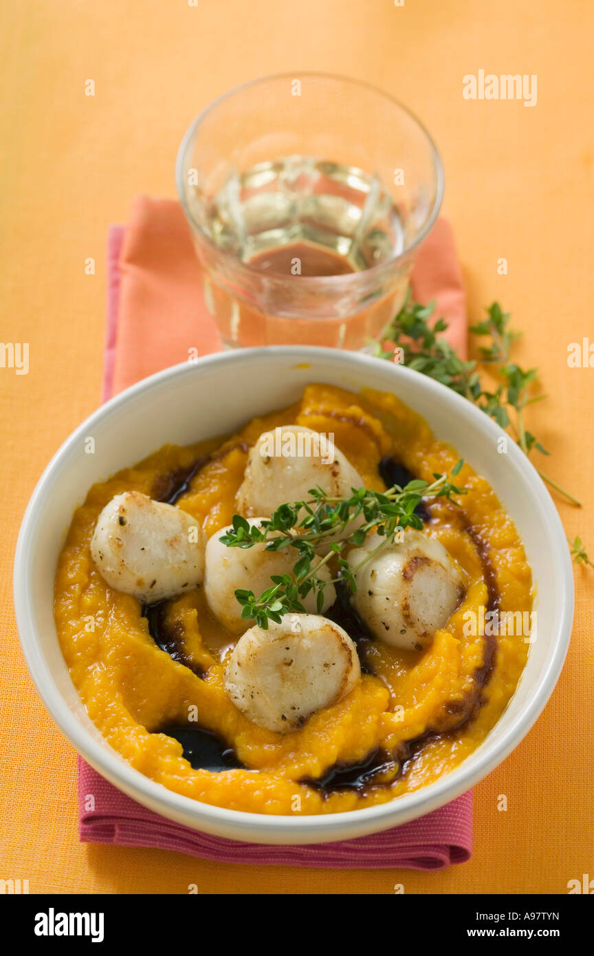 Scallops with pumpkin puree and thyme FoodCollection Stock Photo