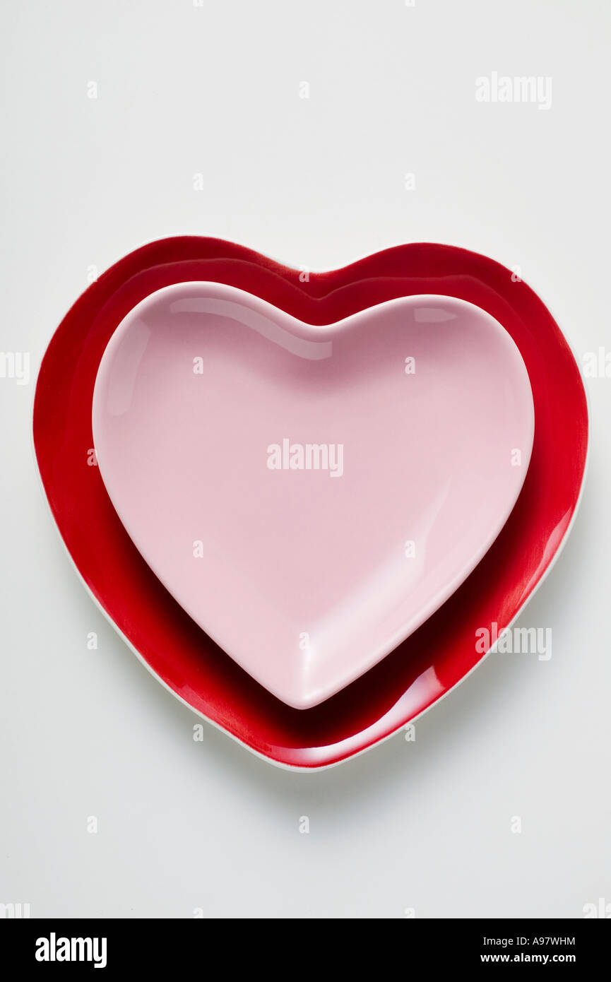 Two heart shaped plates one on top of the other FoodCollection Stock