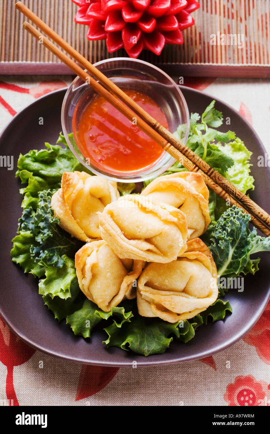 Deep fried wontons with sweet and sour sauce FoodCollection Stock Photo