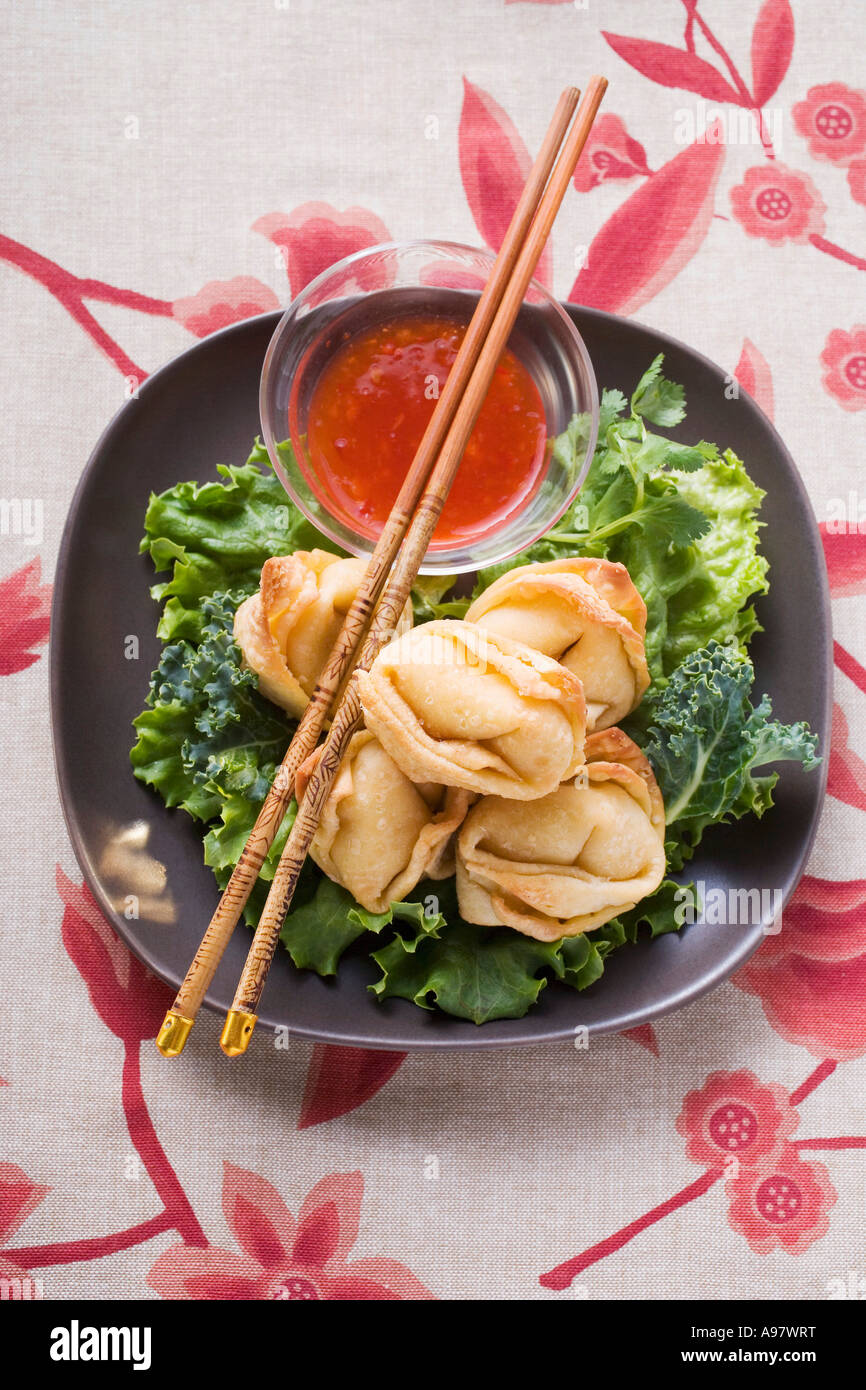 Deep fried wontons with sweet and sour sauce FoodCollection Stock Photo