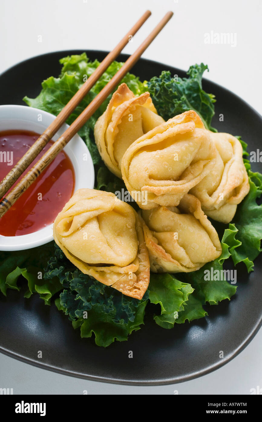 Deep fried wontons with sweet and sour sauce FoodCollection Stock Photo