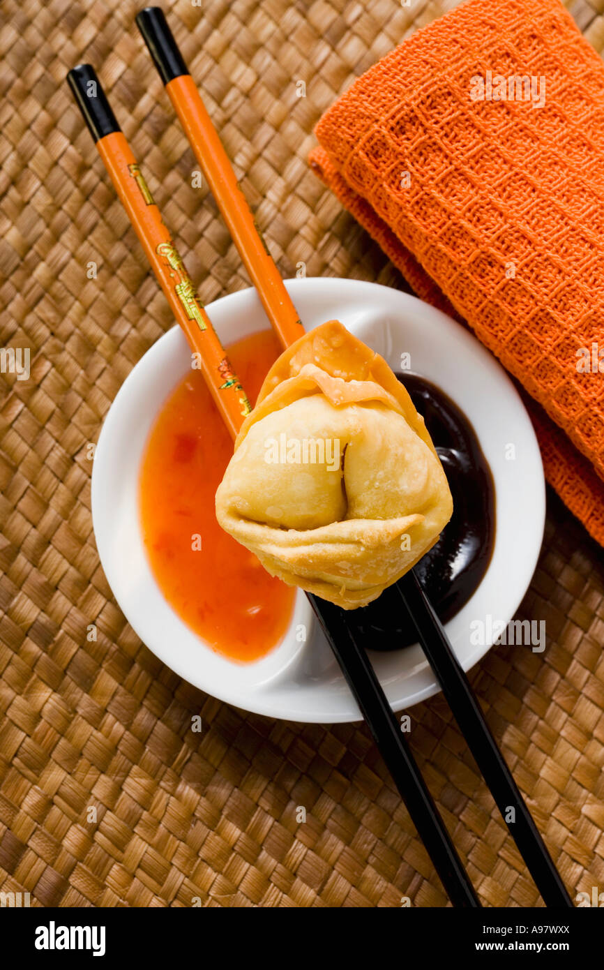 A deep fried wonton with two sauces FoodCollection Stock Photo Alamy