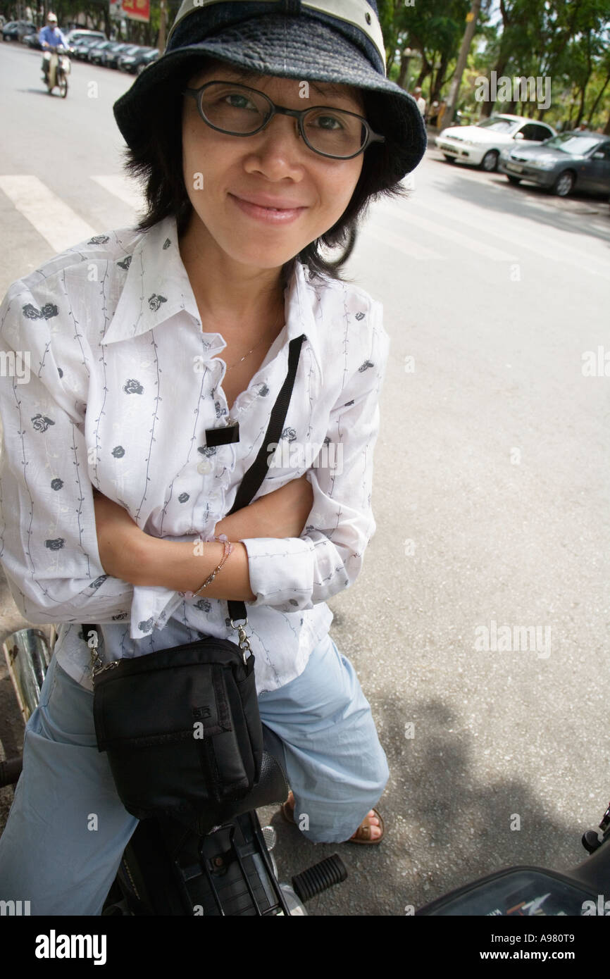 Young woman on motorbike, Ho Chi Minh City (Saigon), Vietnam Stock Photo