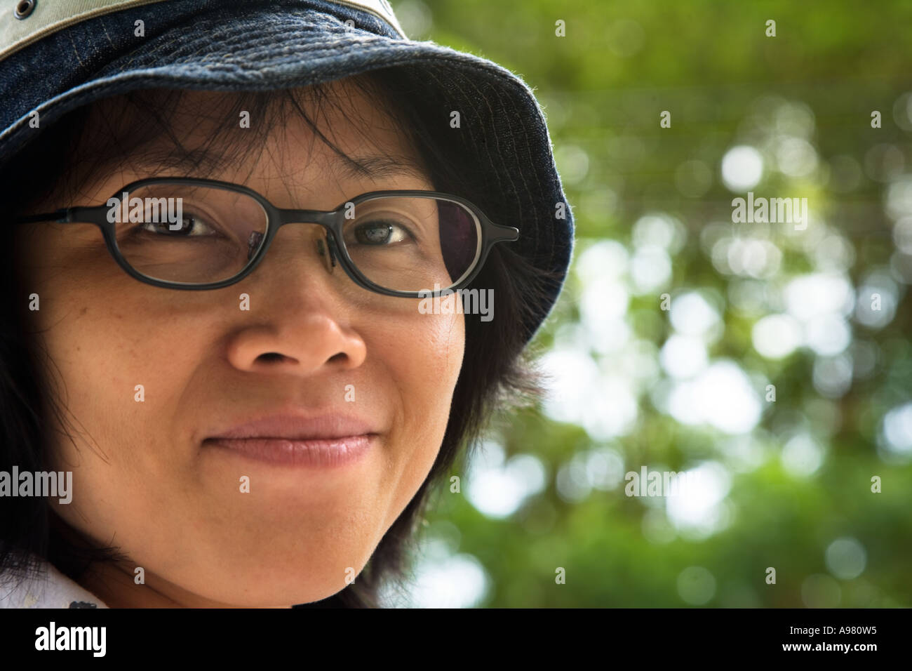 Happy, young Vietnamese woman with hat and glasses, Ho Chi Minh City  (Saigon), Vietnam Stock Photo - Alamy
