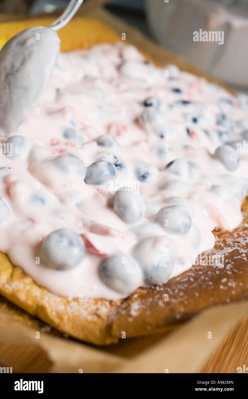 Filling a sponge roulade FoodCollection Stock Photo Alamy