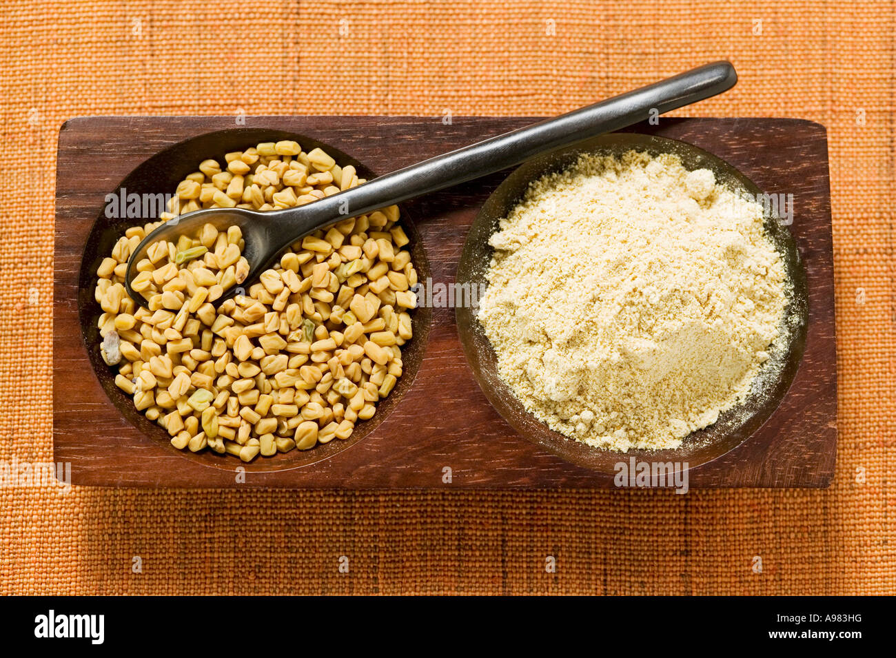 Fenugreek seeds unground and ground FoodCollection Stock Photo