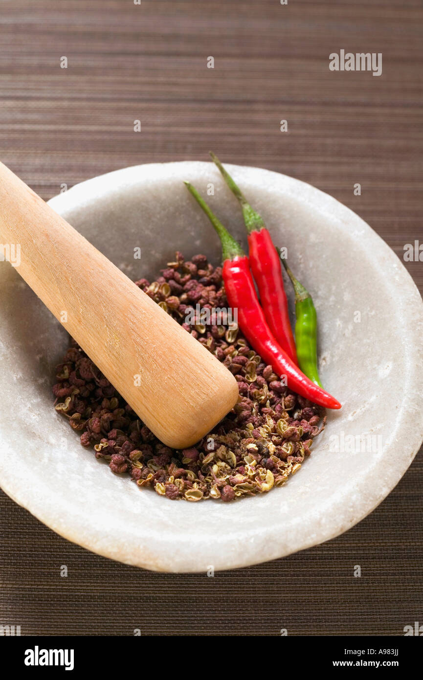Szechuan pepper and chili peppers in mortar FoodCollection Stock Photo