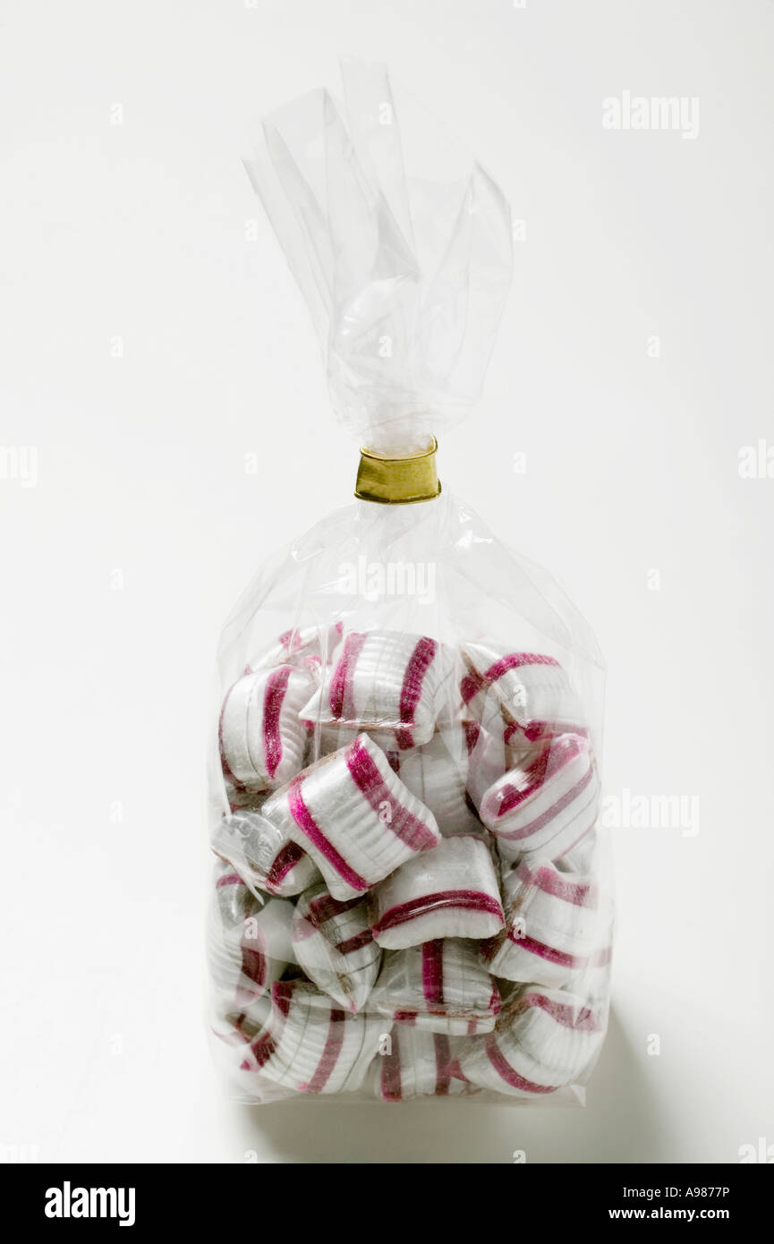 Cherry mint sweets in cellophane bag FoodCollection Stock Photo