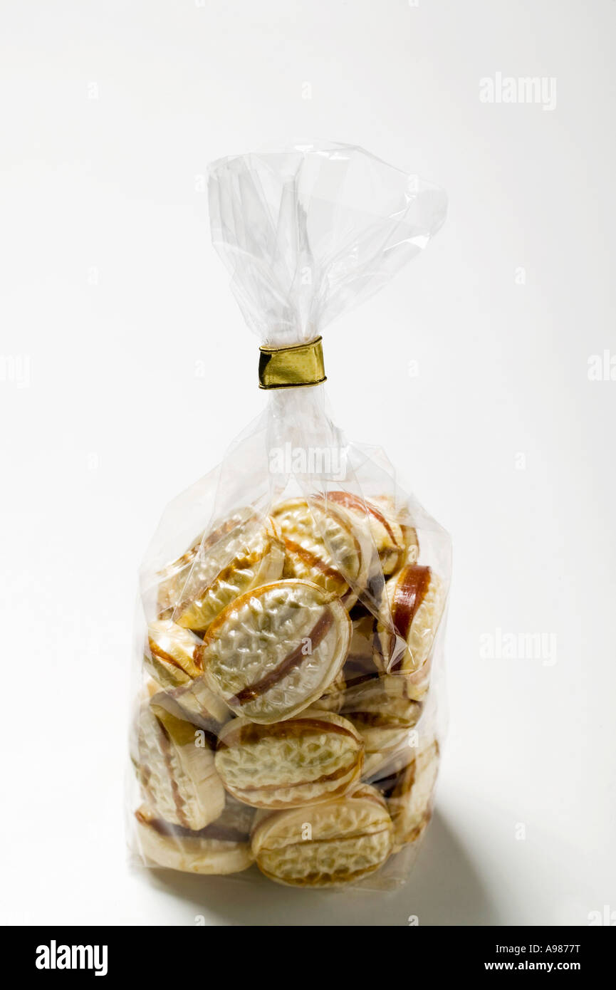 Caramel sweets in cellophane bag FoodCollection Stock Photo