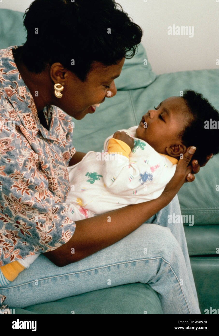 Mother interacting with 2 month old baby Stock Photo Alamy