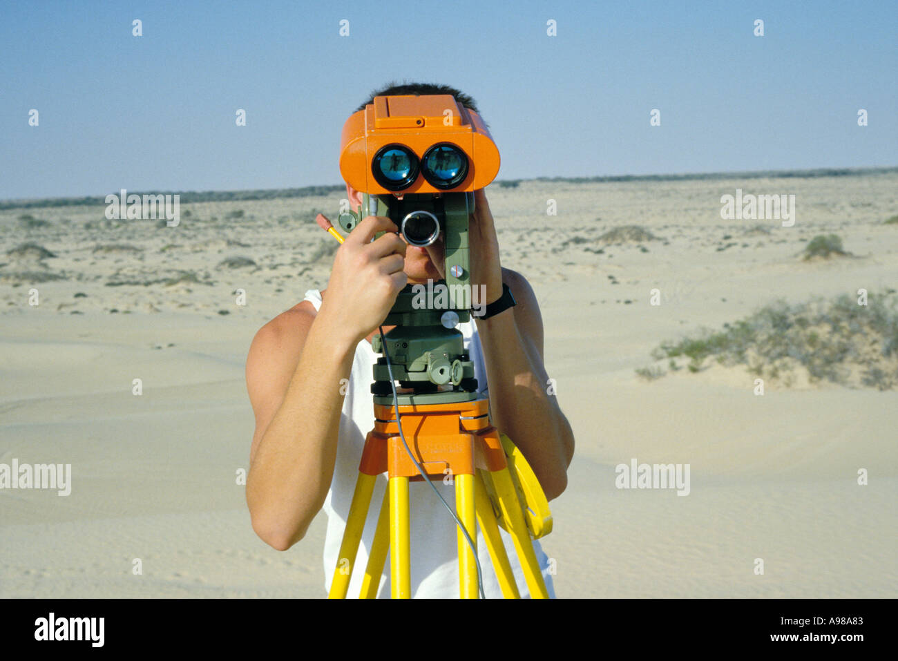 Surveyor landstat at work in the desert Stock Photo Alamy