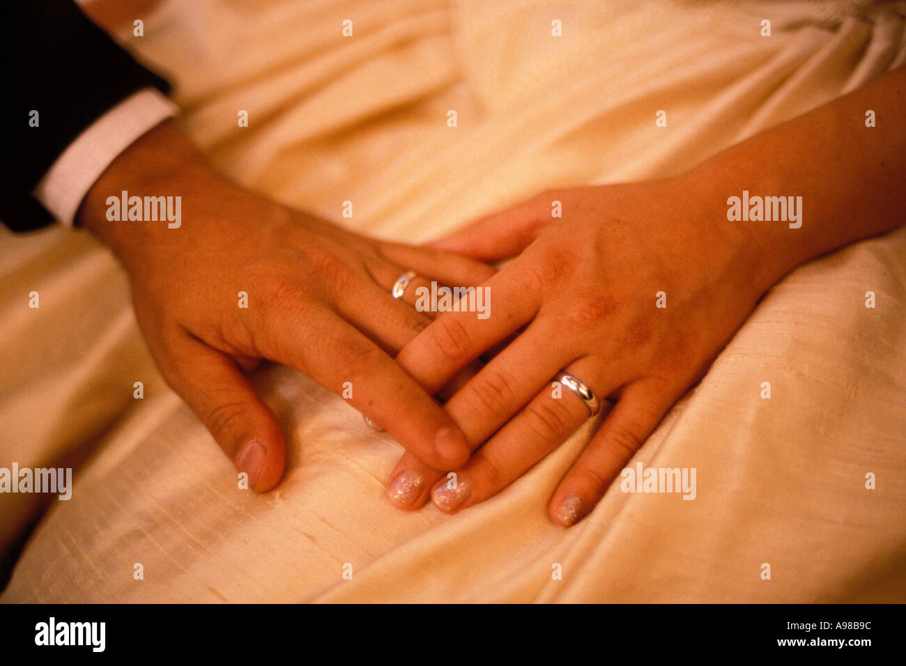 Weddings, Bride and groom, hands and rings Stock Photo