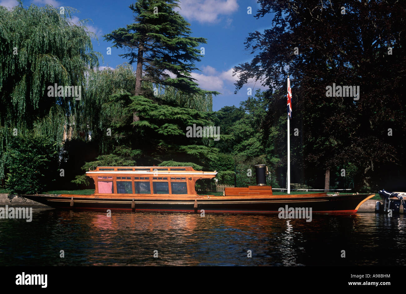 Classic wooden boat: Steam cabin launch moored on River Thames near Henley on Thames, England Stock Photo