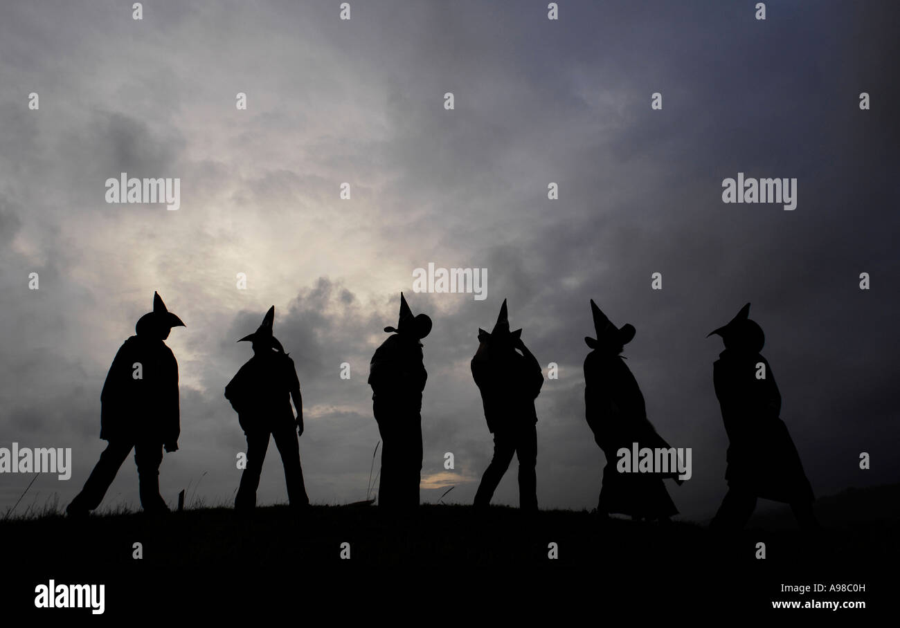 Halloween revellers celebrate the Pagan new year and Celtic festival of Samhain, Devon against a dark sky Stock Photo