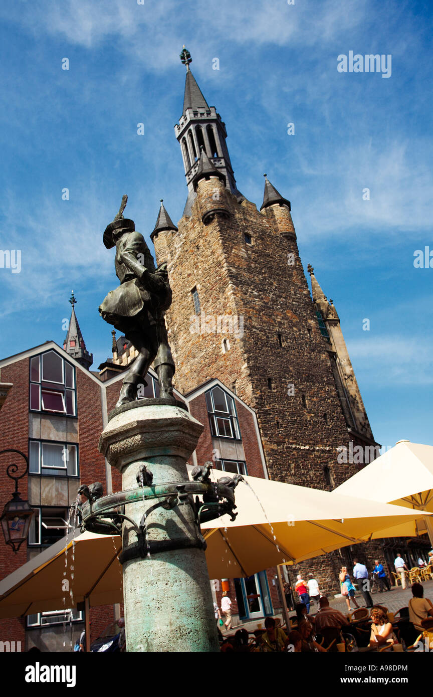 Chicken thief fountain, Huehnermarkt market and Rathaus town hall tower in Aachen, Germany, Europe Stock Photo