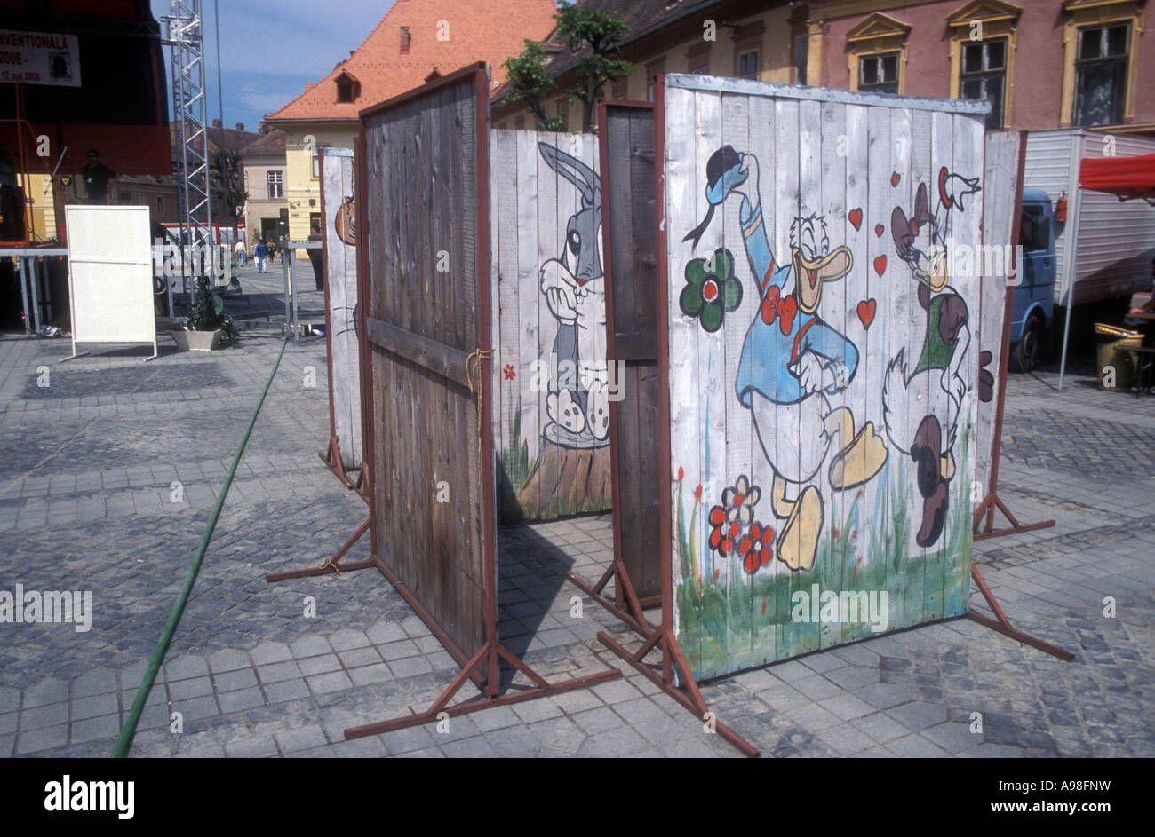Display of wooden panels with Disney cartoon characters at Sibiu main square during  Festival De Arta Neconventionala La Strada Stock Photo