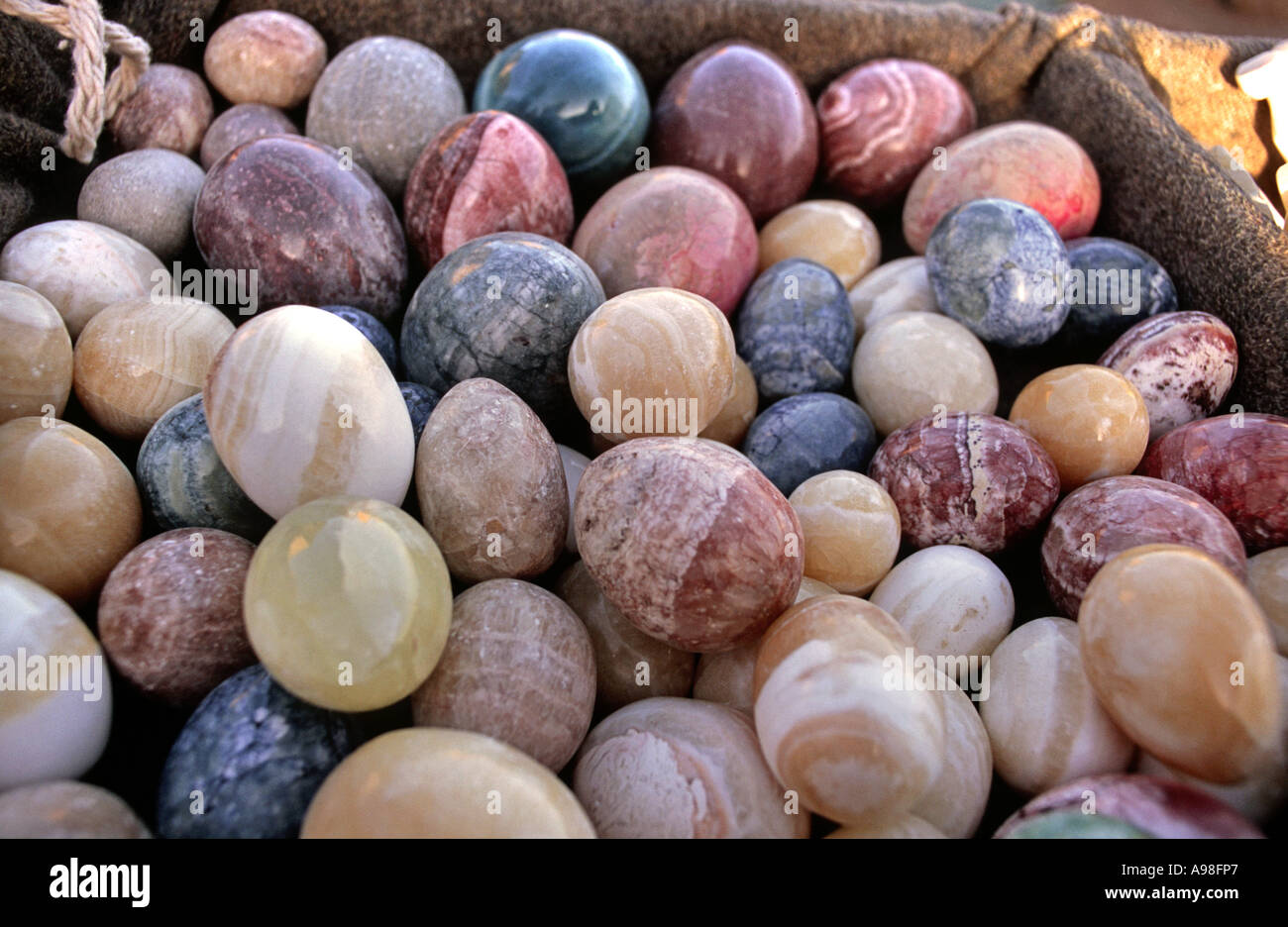Selection of carved stone eggs for sale on a Bedouin stall on the
