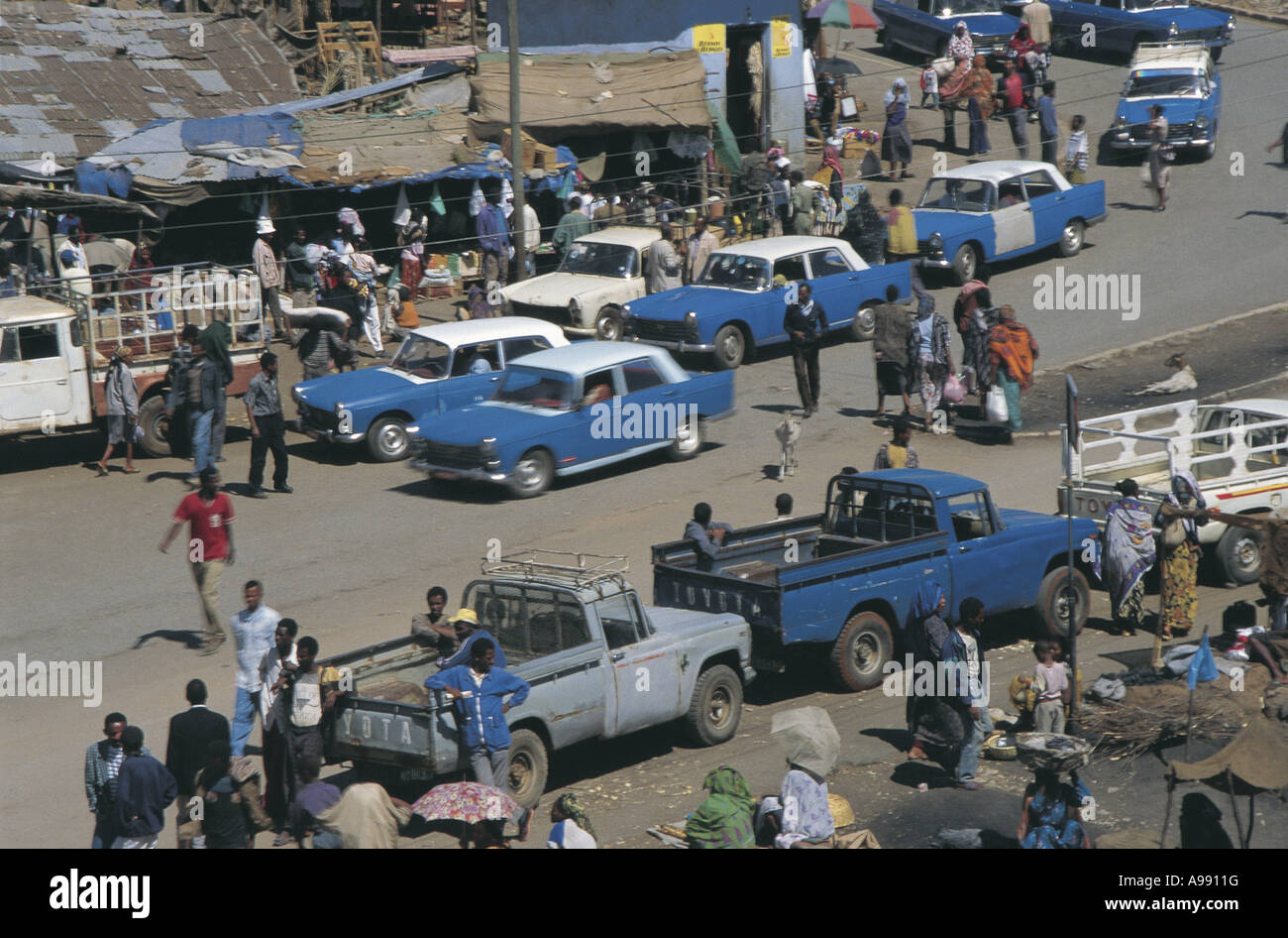 Market day with traditional blue and white taxis Harer Ethiopia Stock Photo