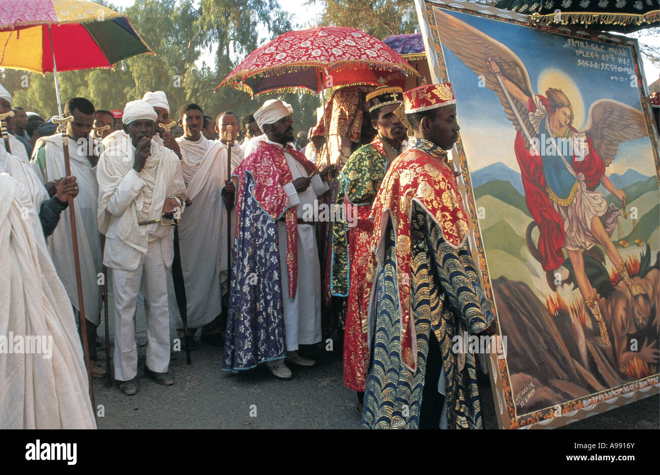 Timkat celebrations Lalibela Ethiopia Monks or Priests are carrying a large framed painting of an Angel as a symbol Stock Photo