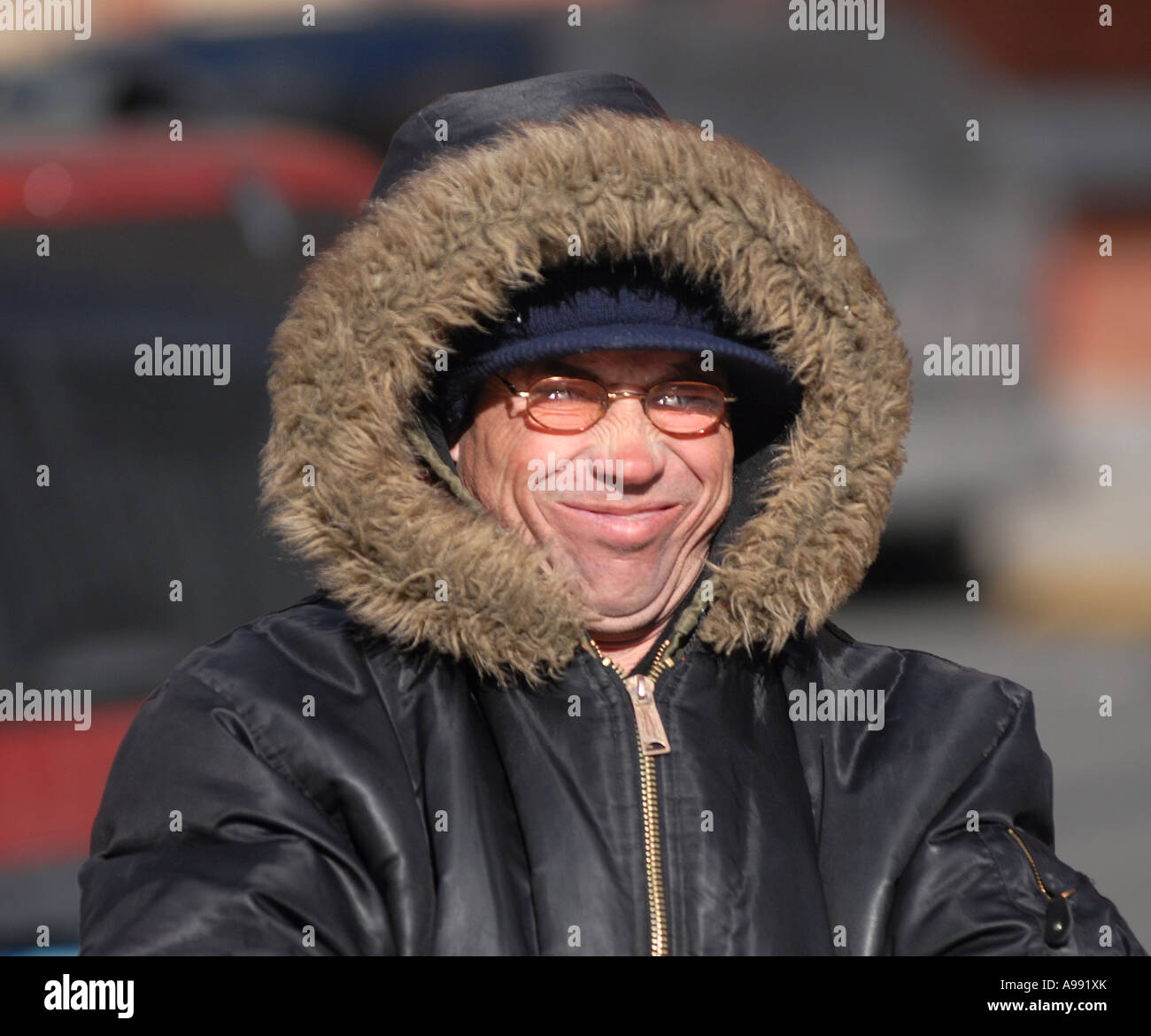 A Man makes a funny face as Very cold winter wind blows on his face Stock  Photo - Alamy