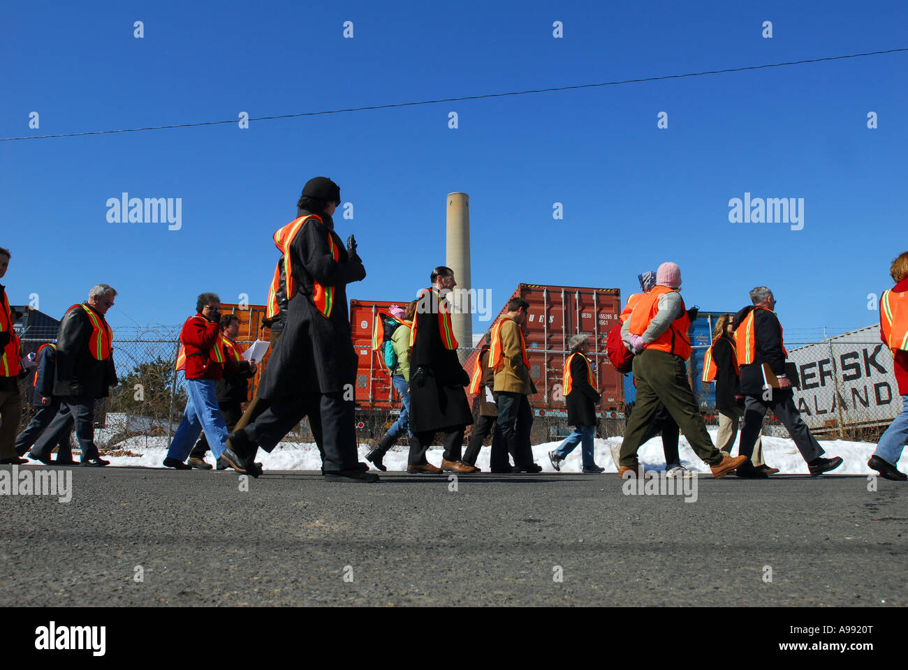 Protesters walk through a portion of the New Haven Harbor in Connecticut that is being closed to public Stock Photo