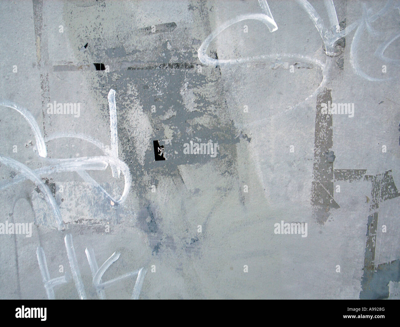 Graffiti and old paint on exterior wall forms an abstract urban texture pattern Stock Photo