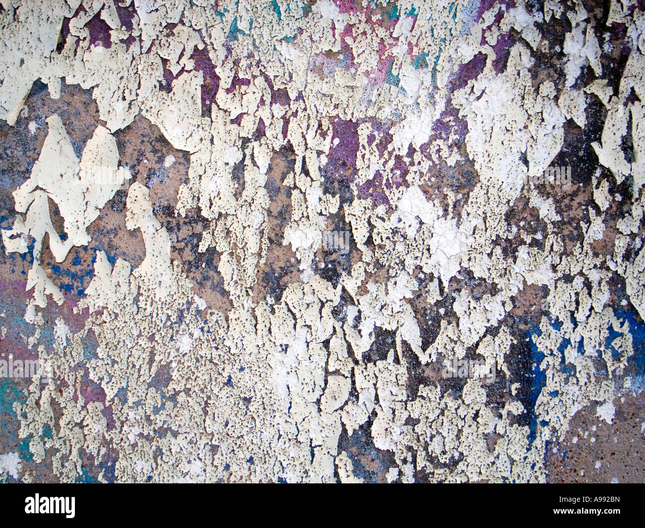 Peeling exterior wall paint creates an urban texture pattern Stock