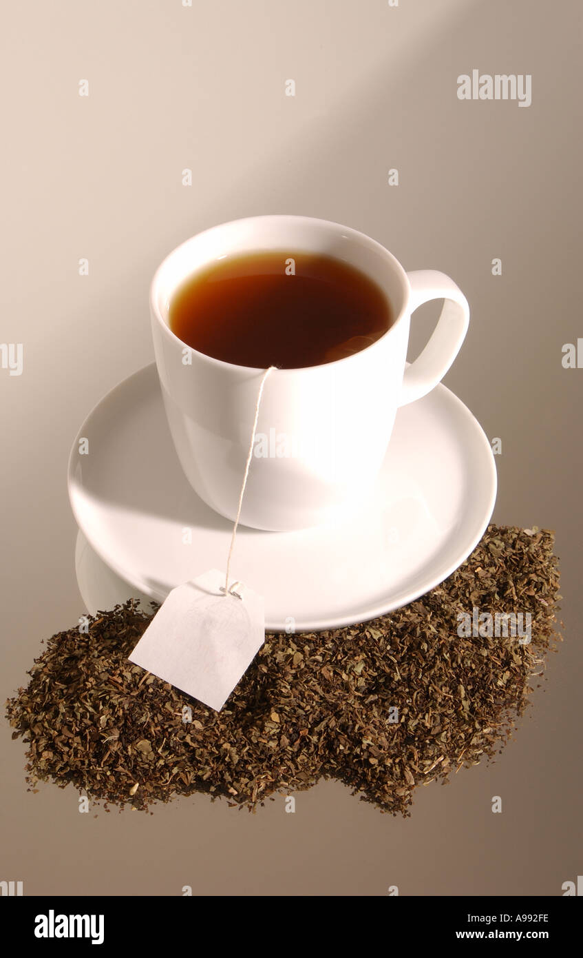 Loose Tea around a Cup of Freshly Made black Tea Stock Photo Alamy