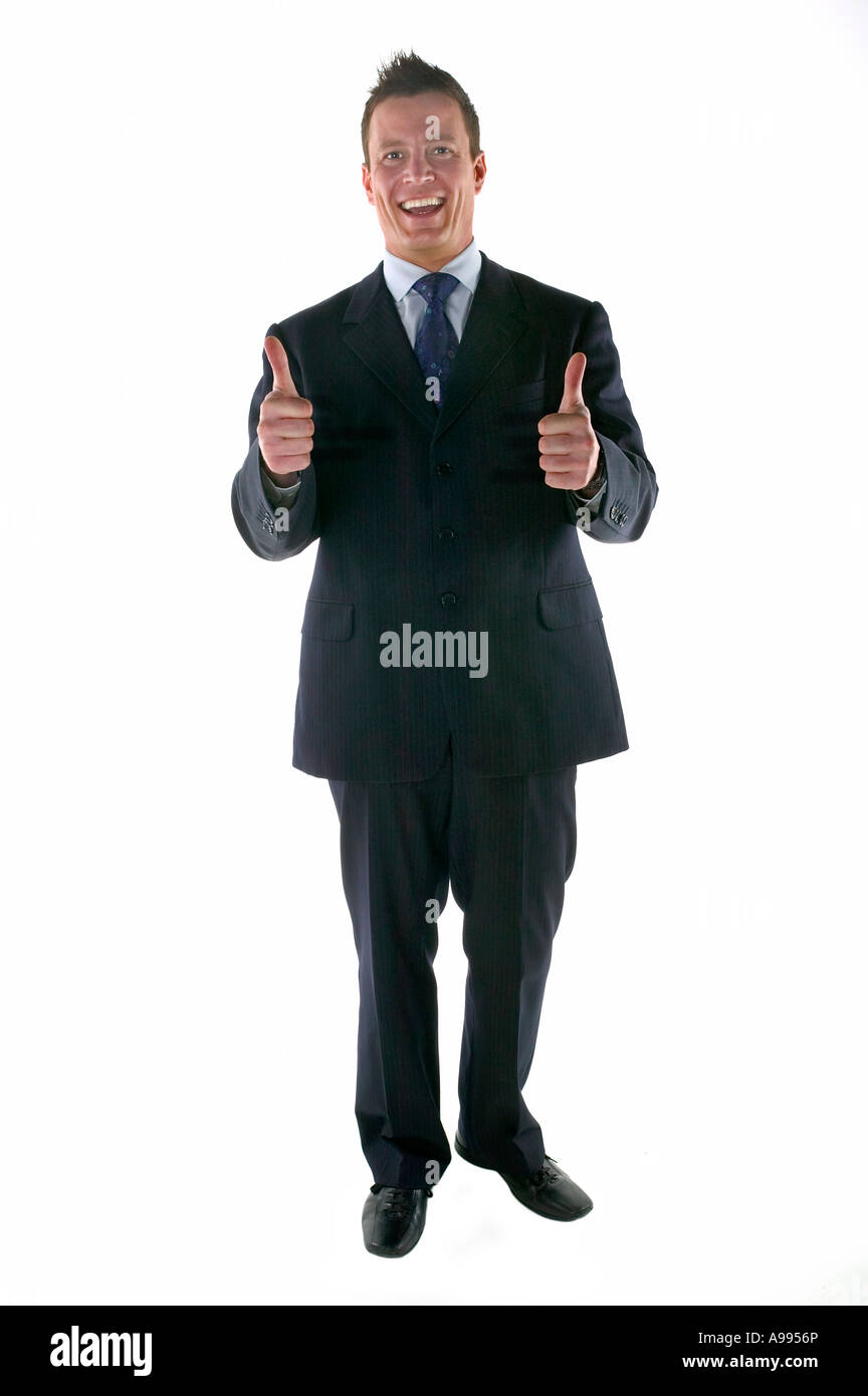 Businessman smiling and giving a thumbs up gesture Stock Photo - Alamy