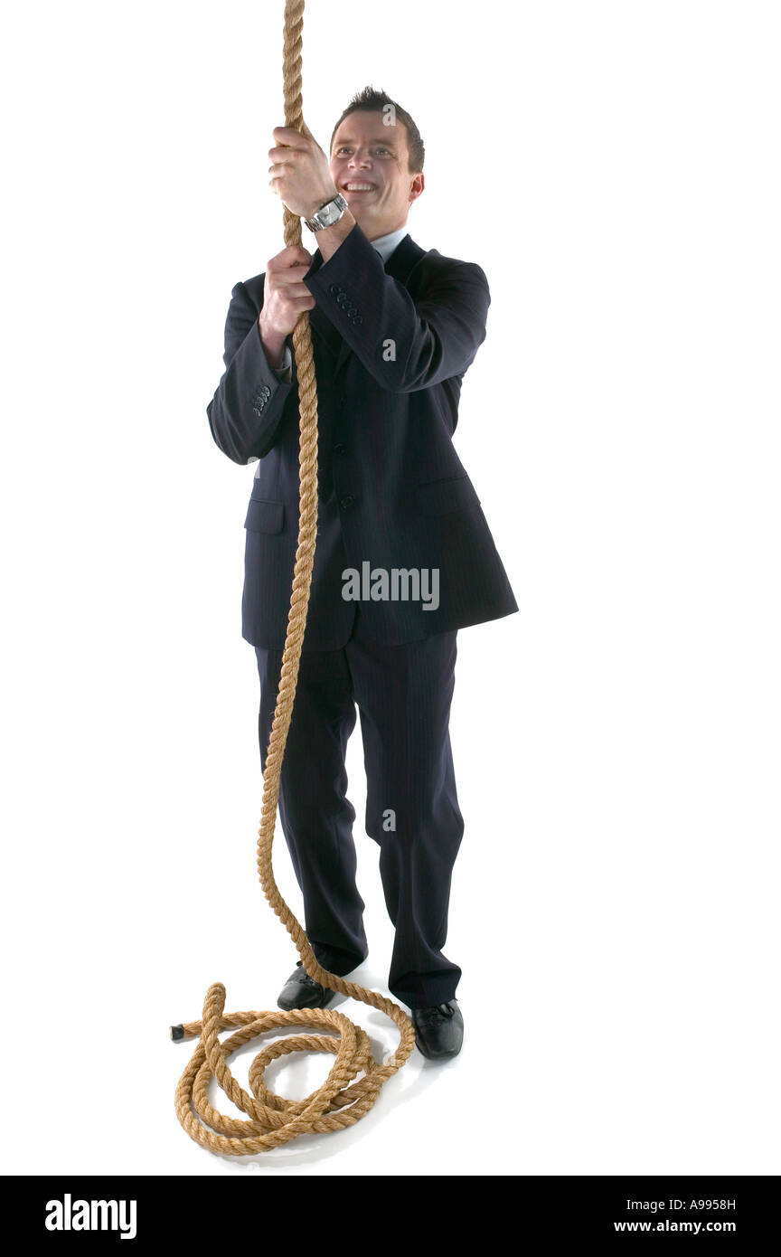 Businessman about to climb a rope isolated on white Stock Photo