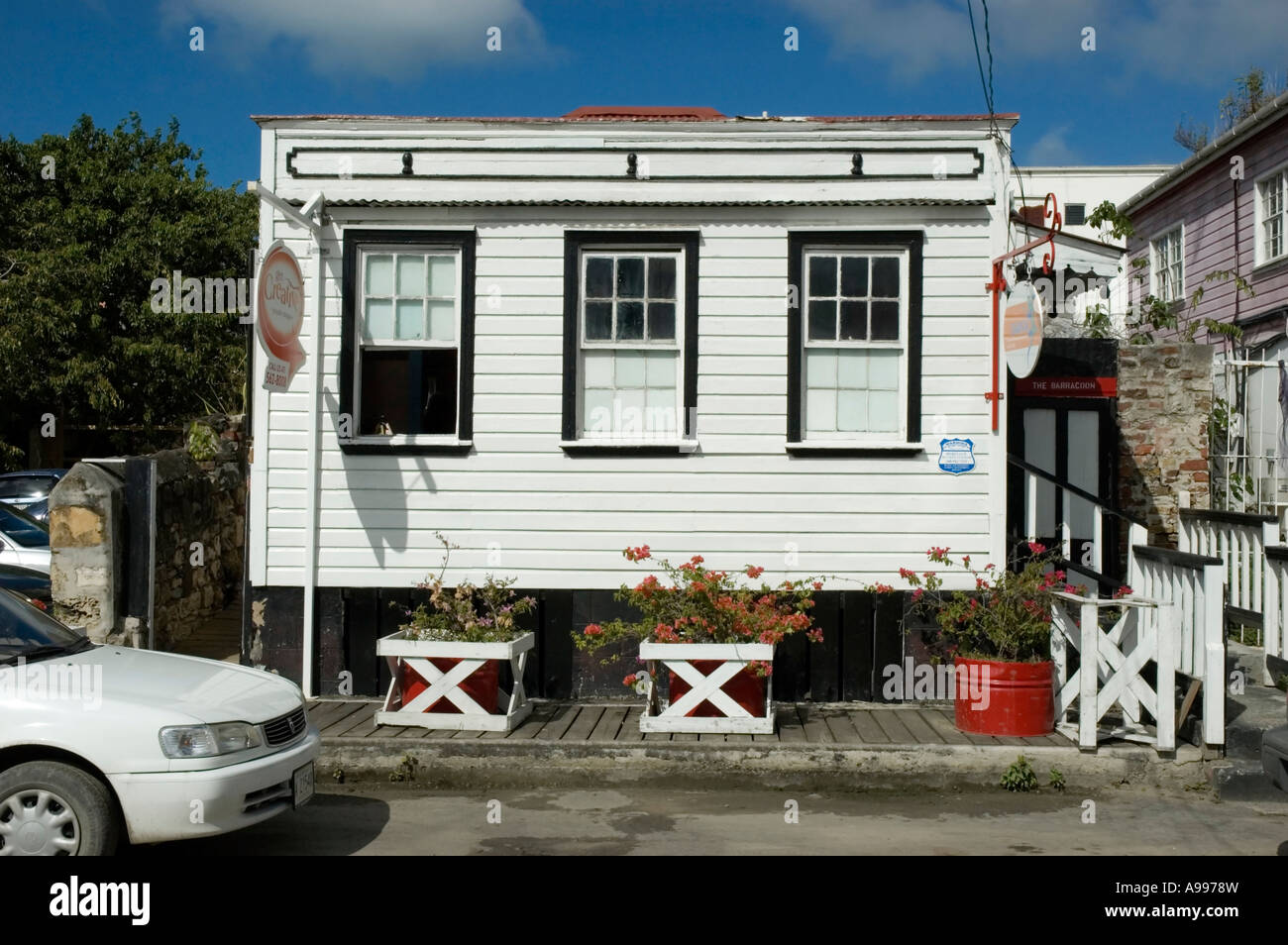 The Coates Cottage, a brightly painted clapboard office which was once used as a holding area for slaves, St John's, Antigua Stock Photo