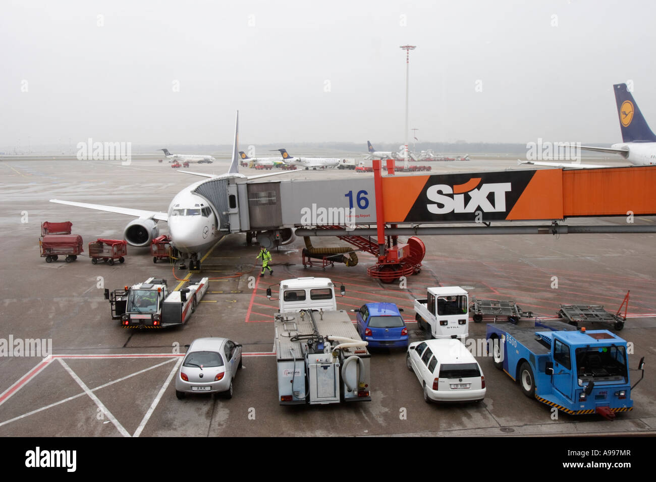 Plane parked at gate in Hamburg airport Stock Photo