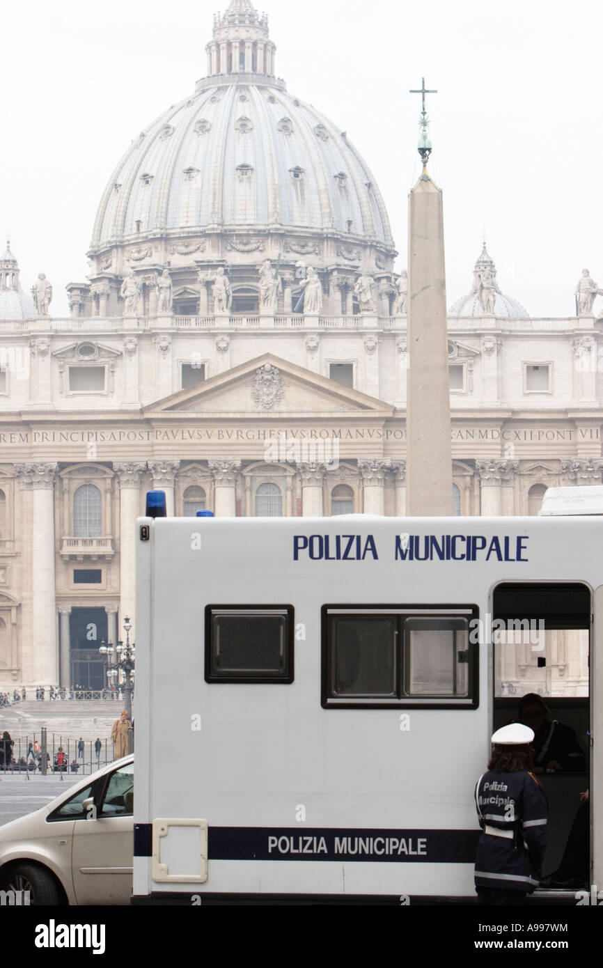 A policewoman of Polizia Municipale talks with her colleagues on St. Peter's Square in Rome, Italy. Stock Photo