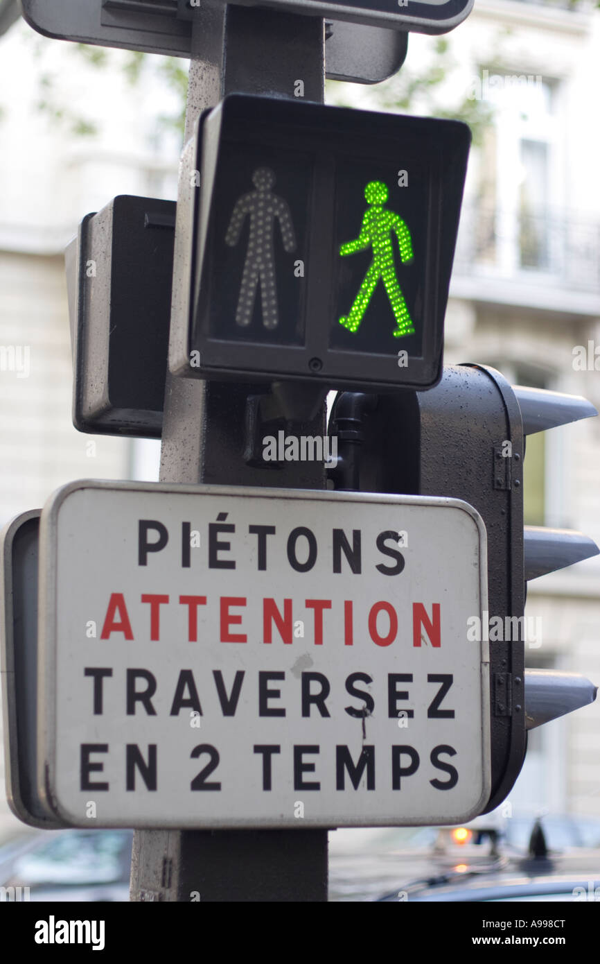 Green traffic light manikin is seen on a crossing in Paris, France