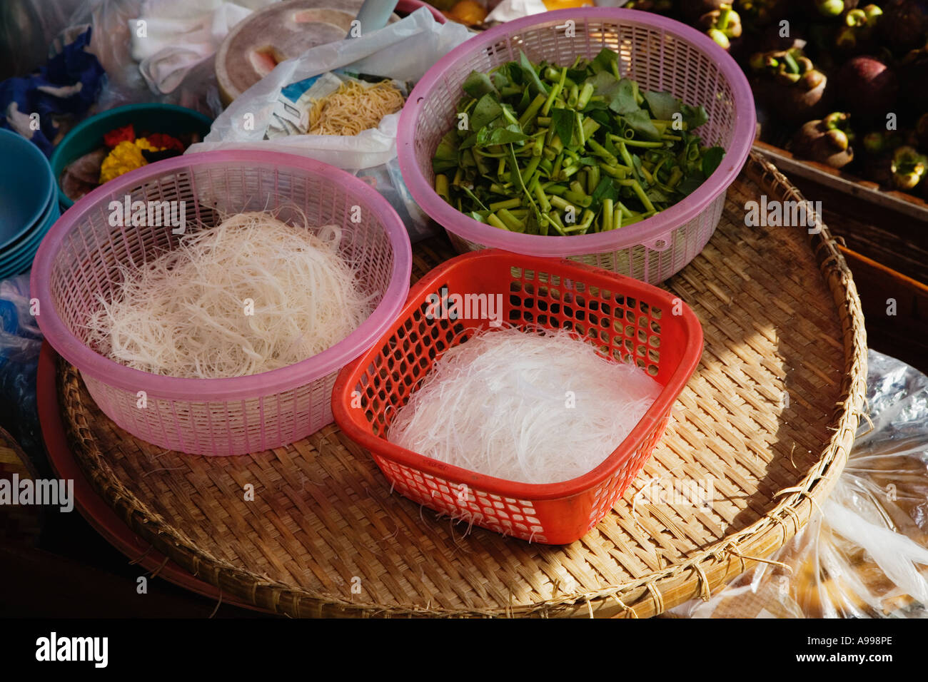Baskets of food for preparations of a traditional Thai dish at the Damnoen Saduak Floating Market Floating markets were common a Stock Photo