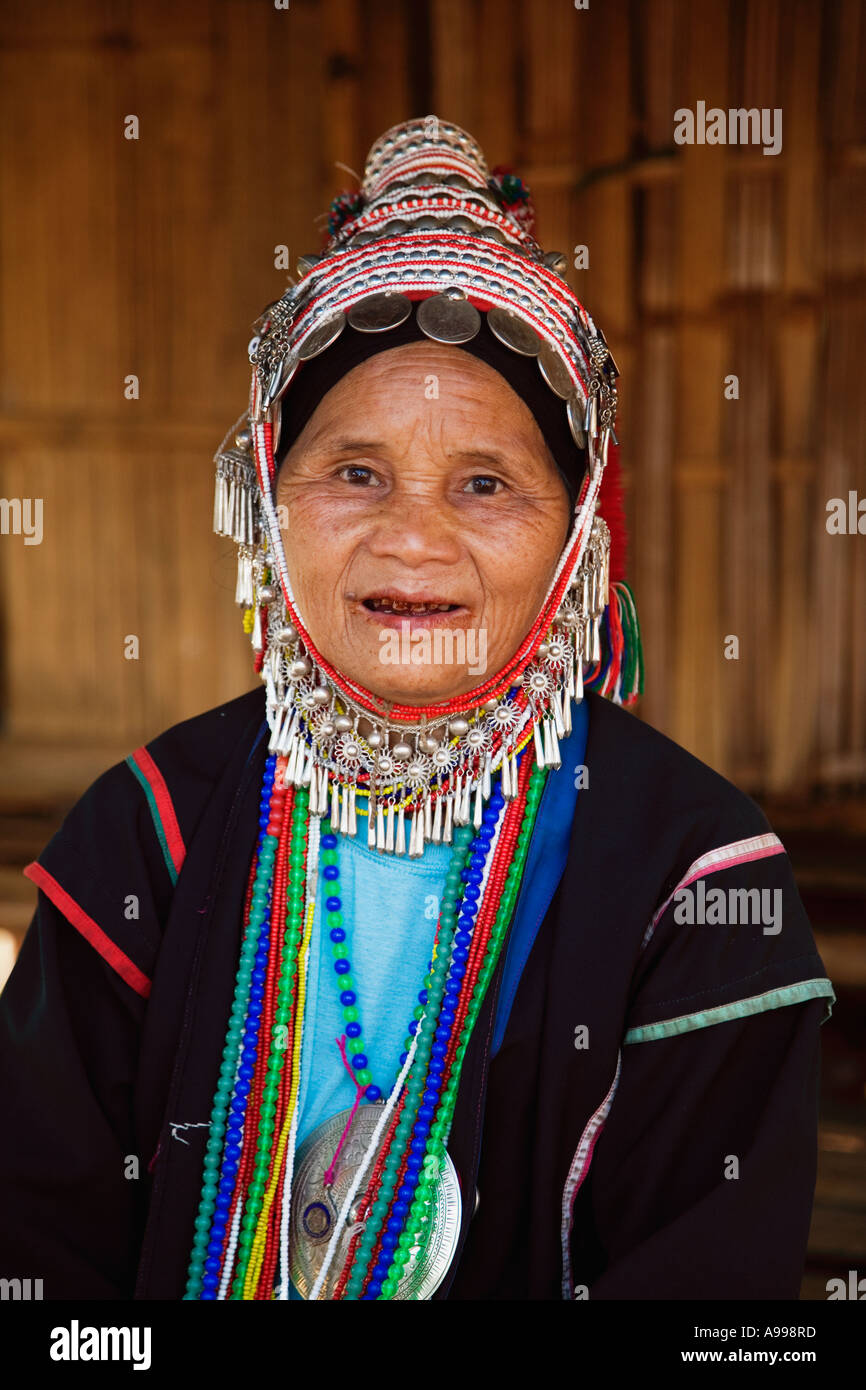 An Akha hilltribe women in their ornate headdresses performing a