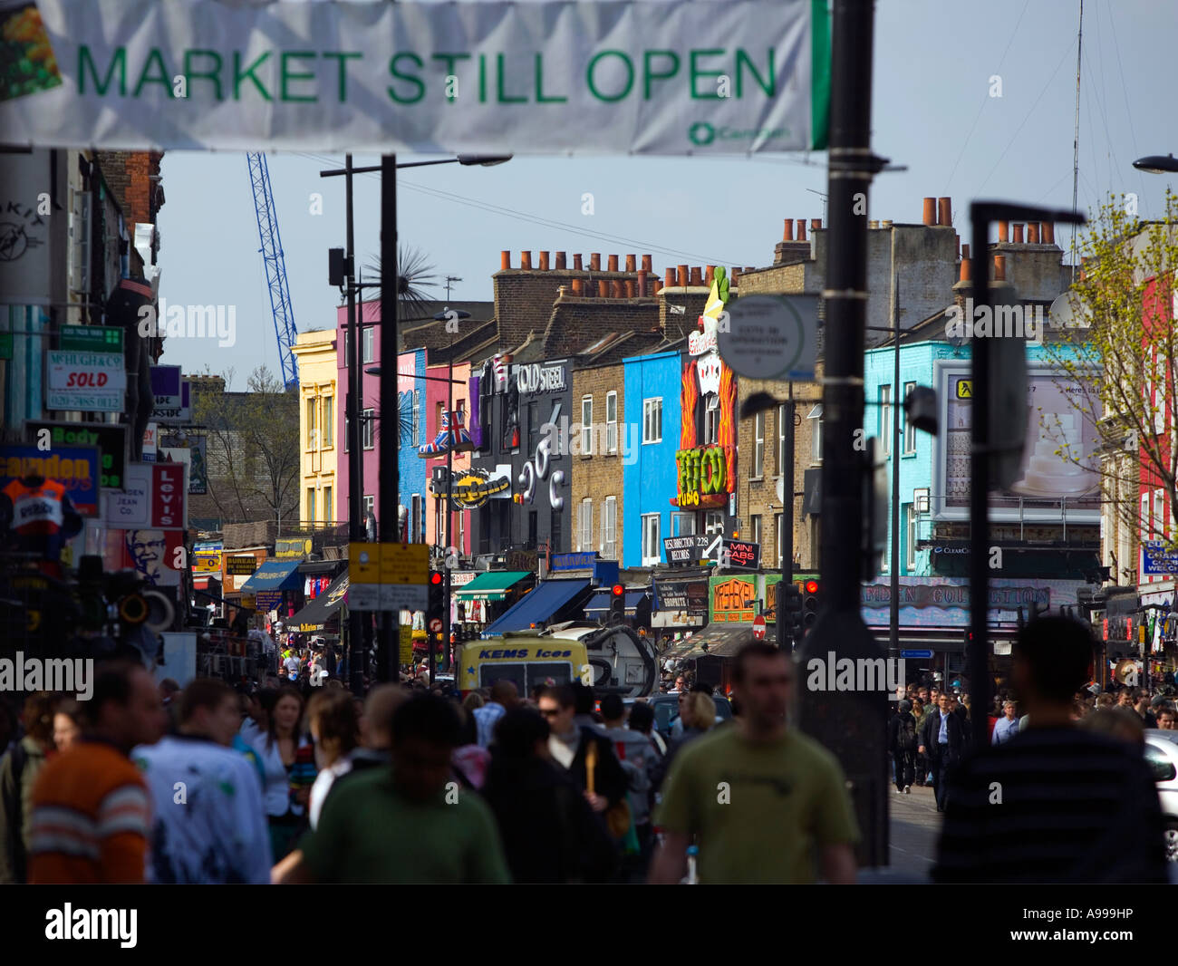 Colourful shops in distance framed. Weekend shopping chaos in 'Camden High Street', L ondon Stock Photo