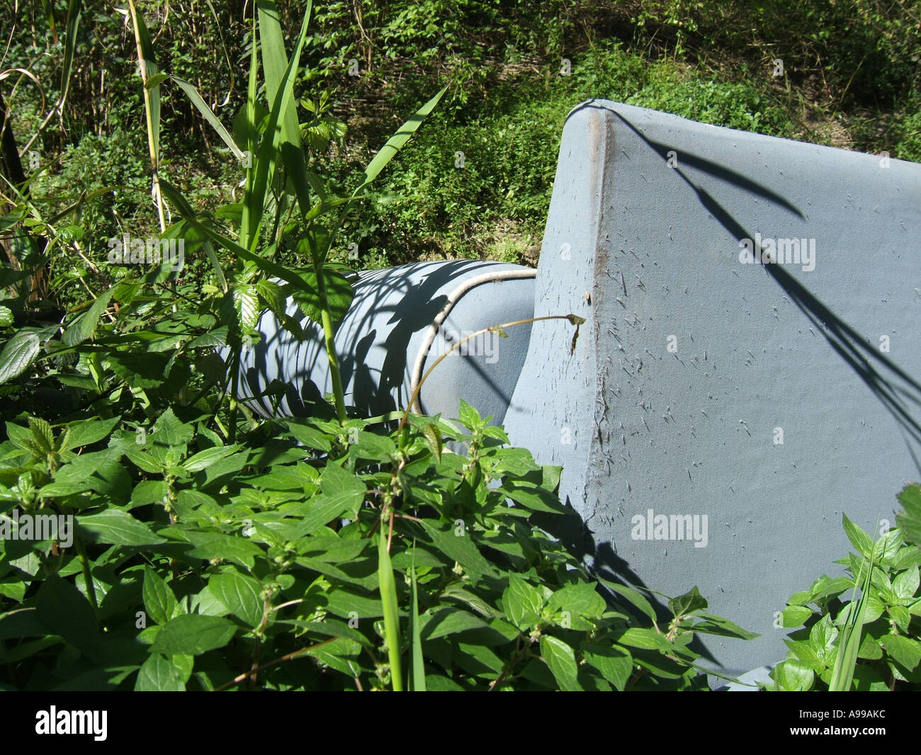 old sofa dumped in field Stock Photo Alamy