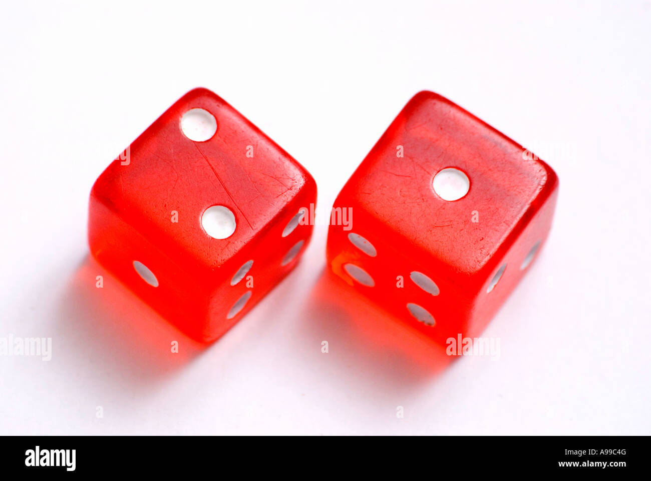 A red pair of dice on a white background Stock Photo