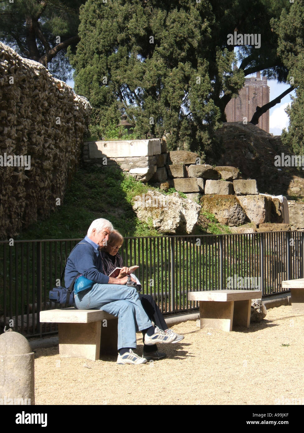 tourists looking at map in rome Stock Photo