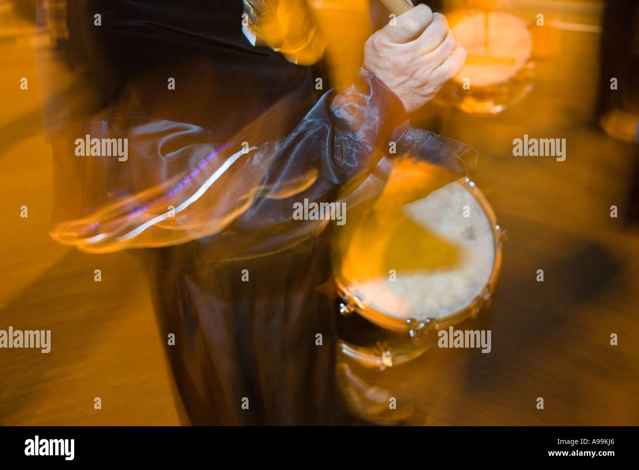 Holy Week Beating Motion blur shot of a religious penitent beating a drum during Holy ...