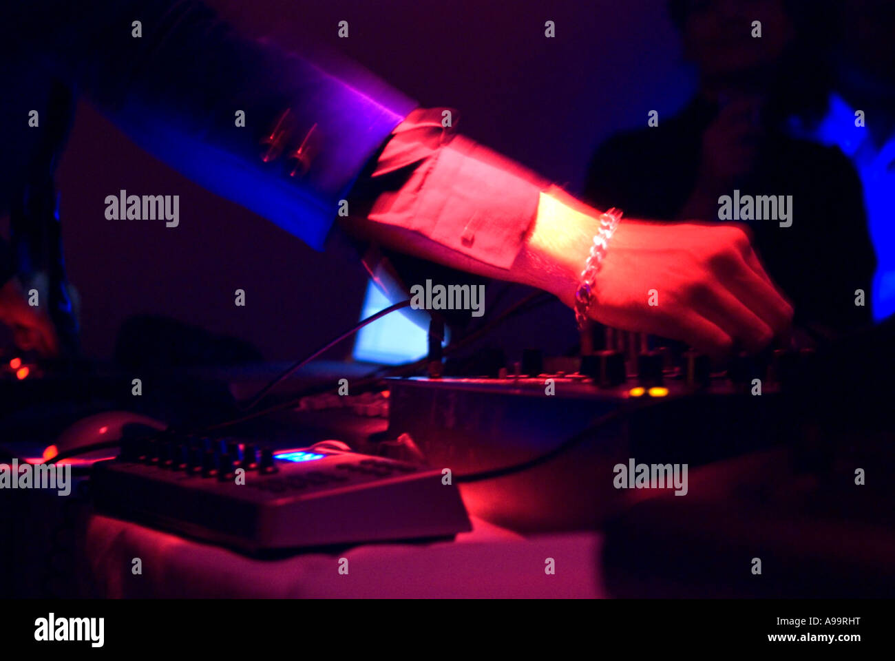 A close up of a dj's hands working his decks at party Stock Photo Alamy