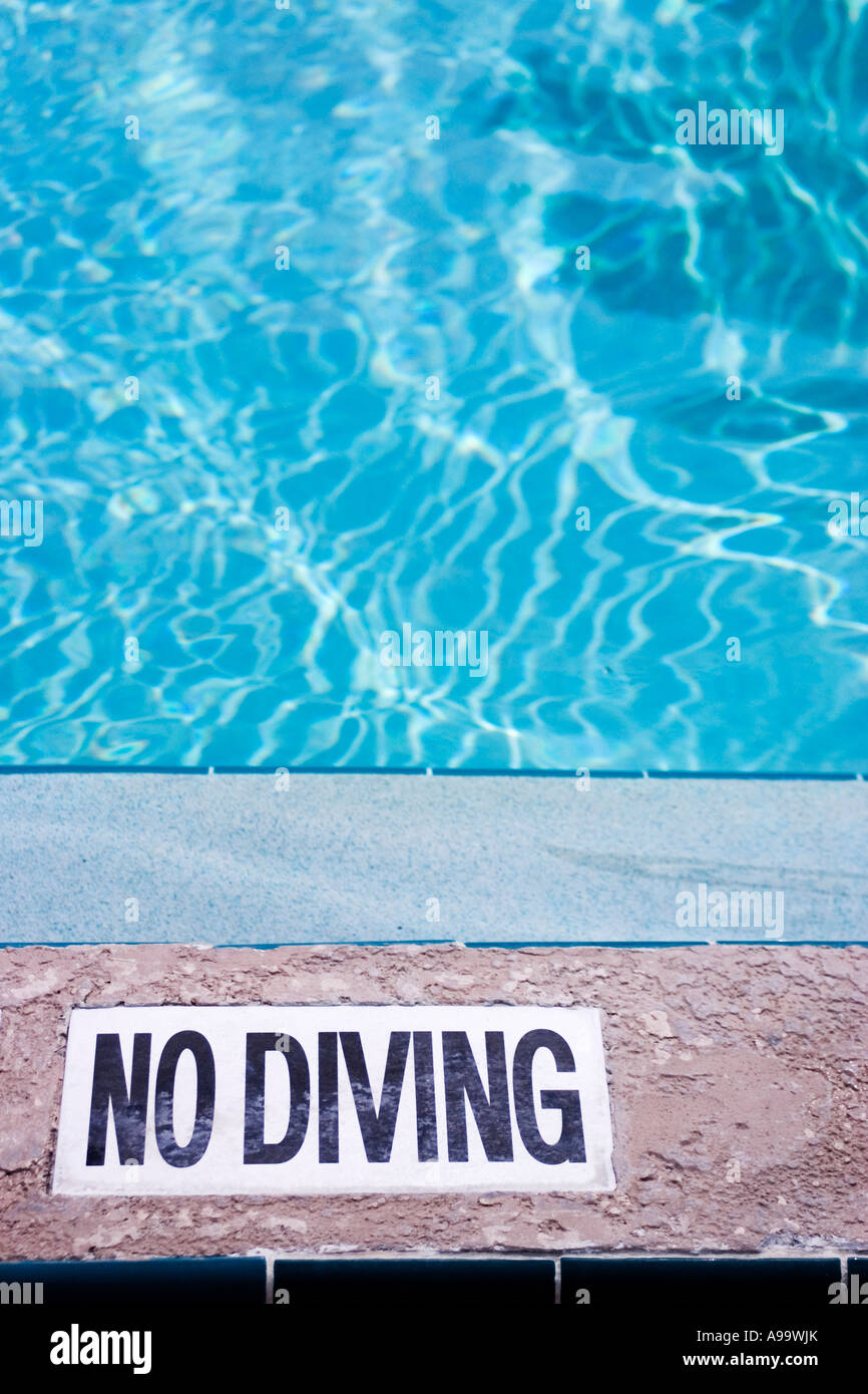 No Diving sign on pool-side concrete Stock Photo - Alamy