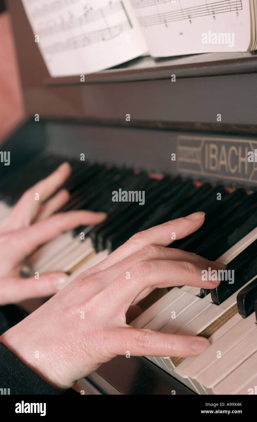 Hands playing piano Stock Photo