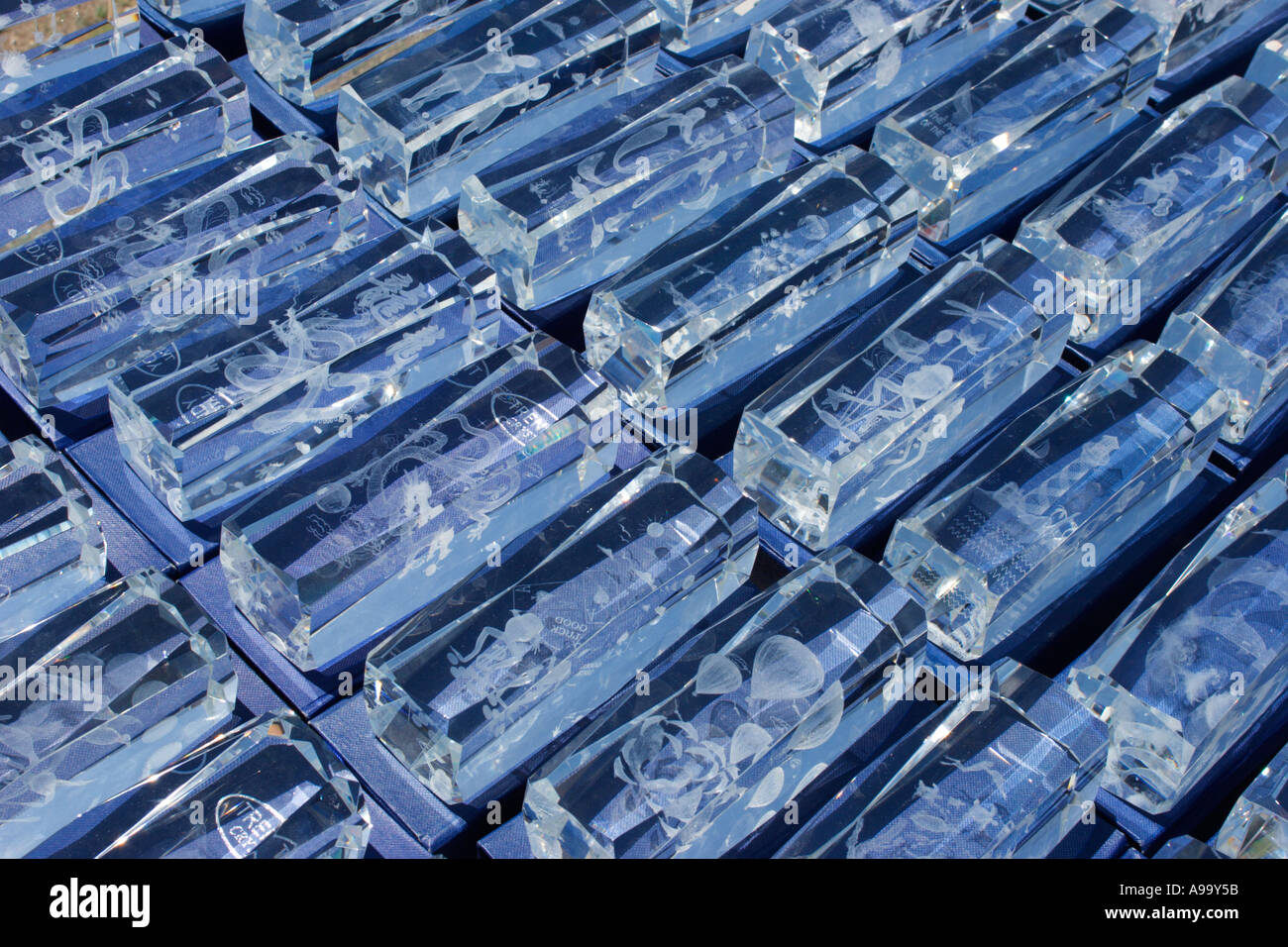 Laser etched glass or plastic ornaments for sale at flea market Stock Photo