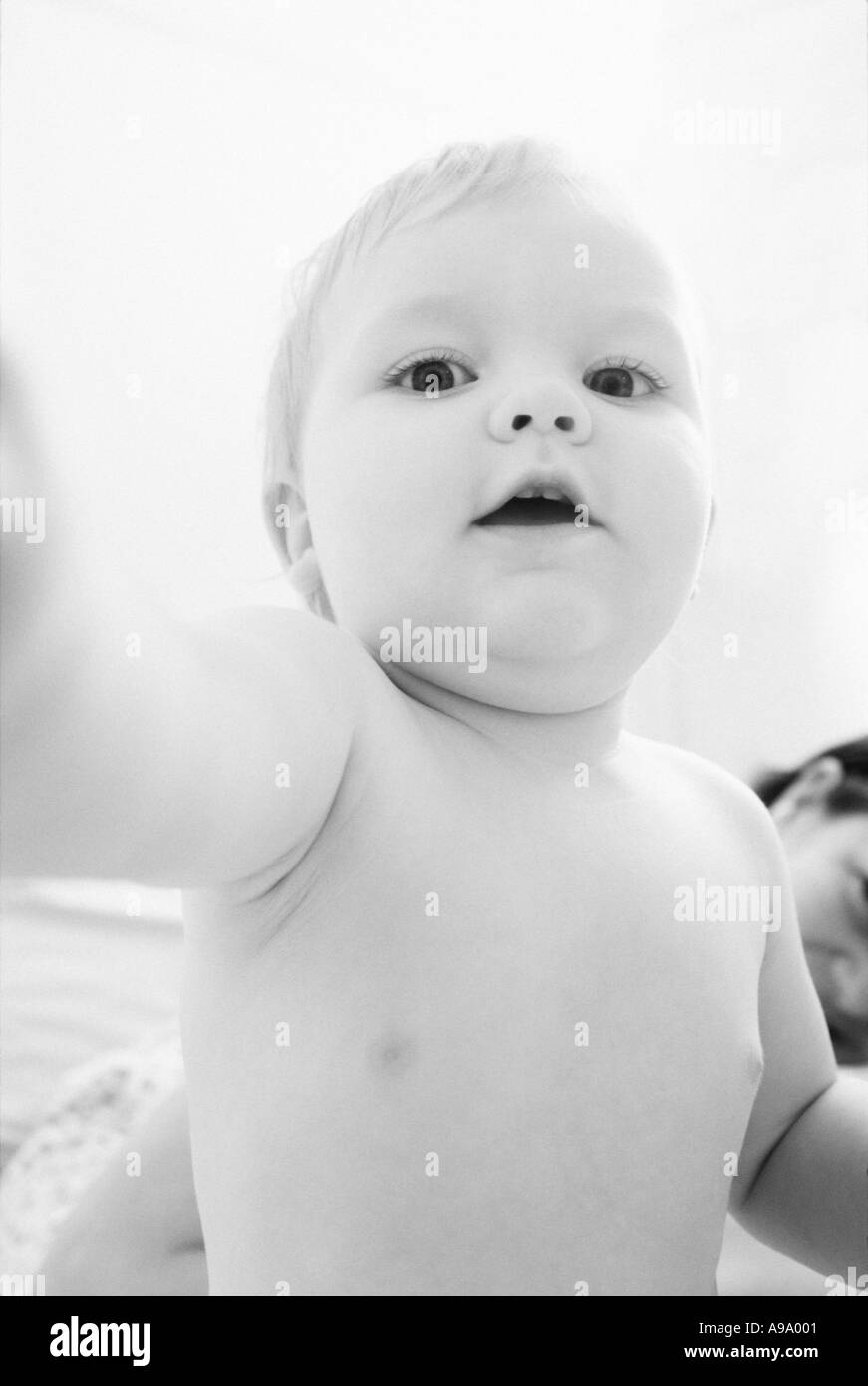 Baby reaching up Black and White Stock Photos & Images - Alamy
