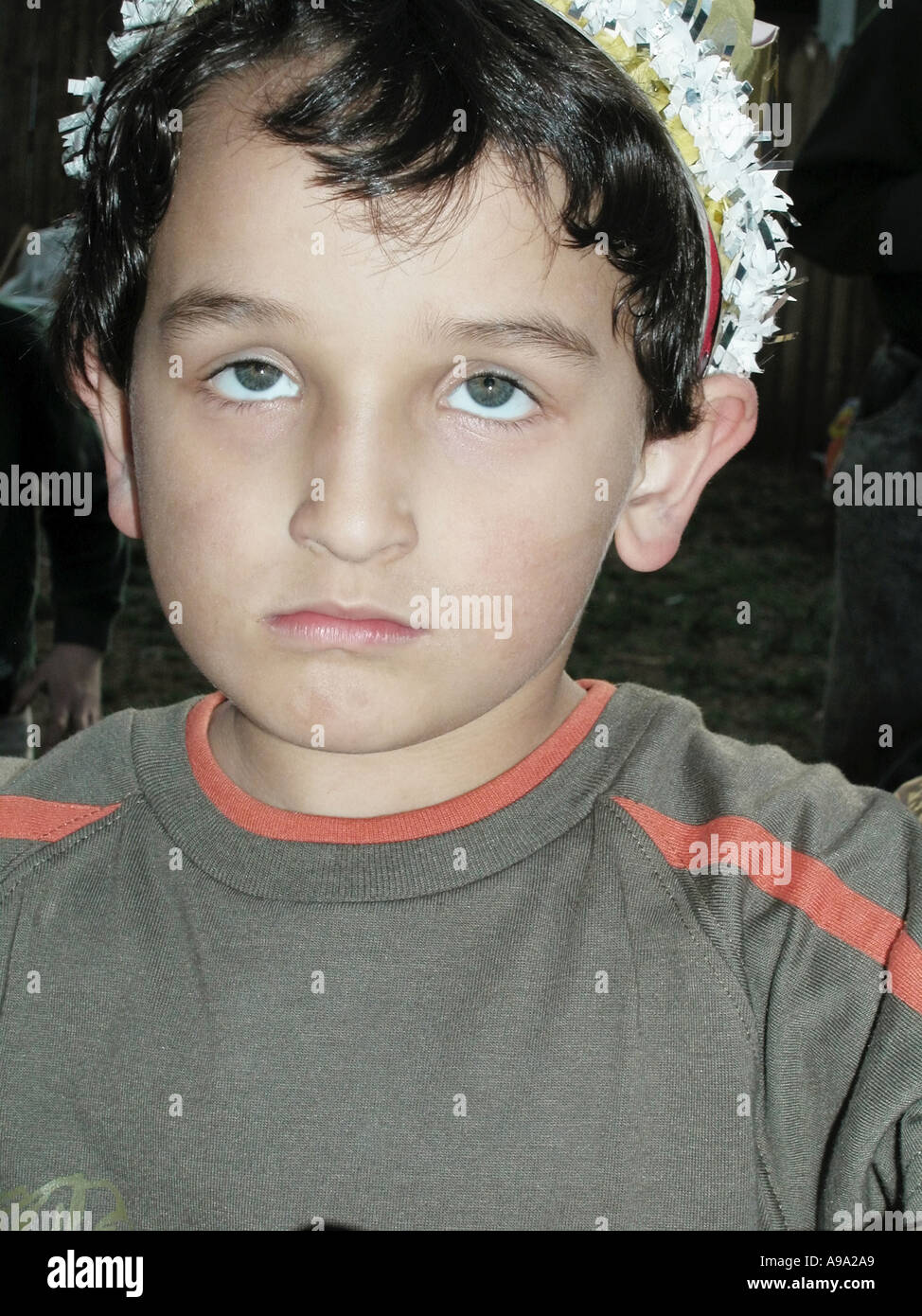 Five year old boy wearing crown at birthday party Stock Photo Alamy