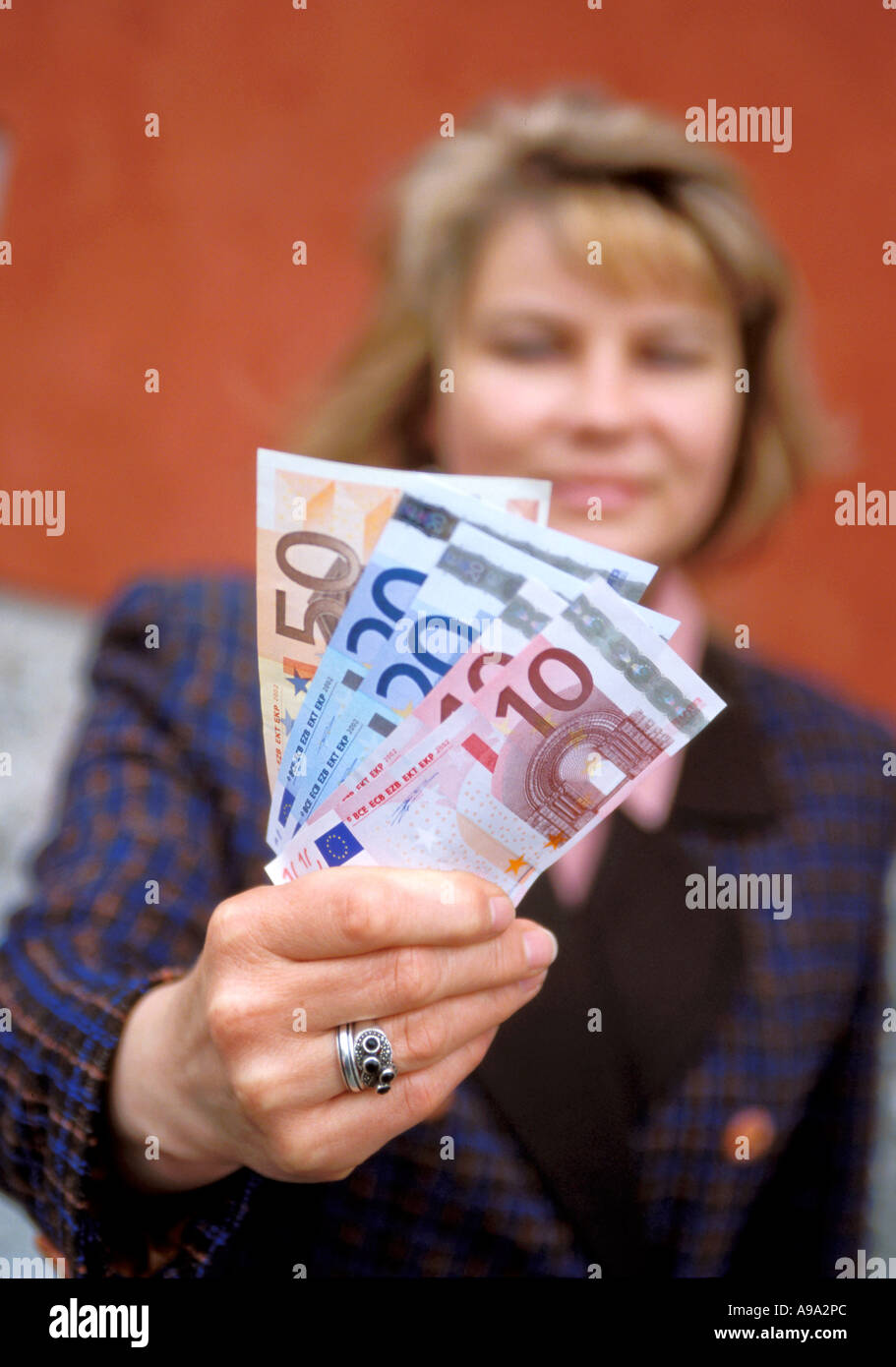 Woman showing Euros Stock Photo