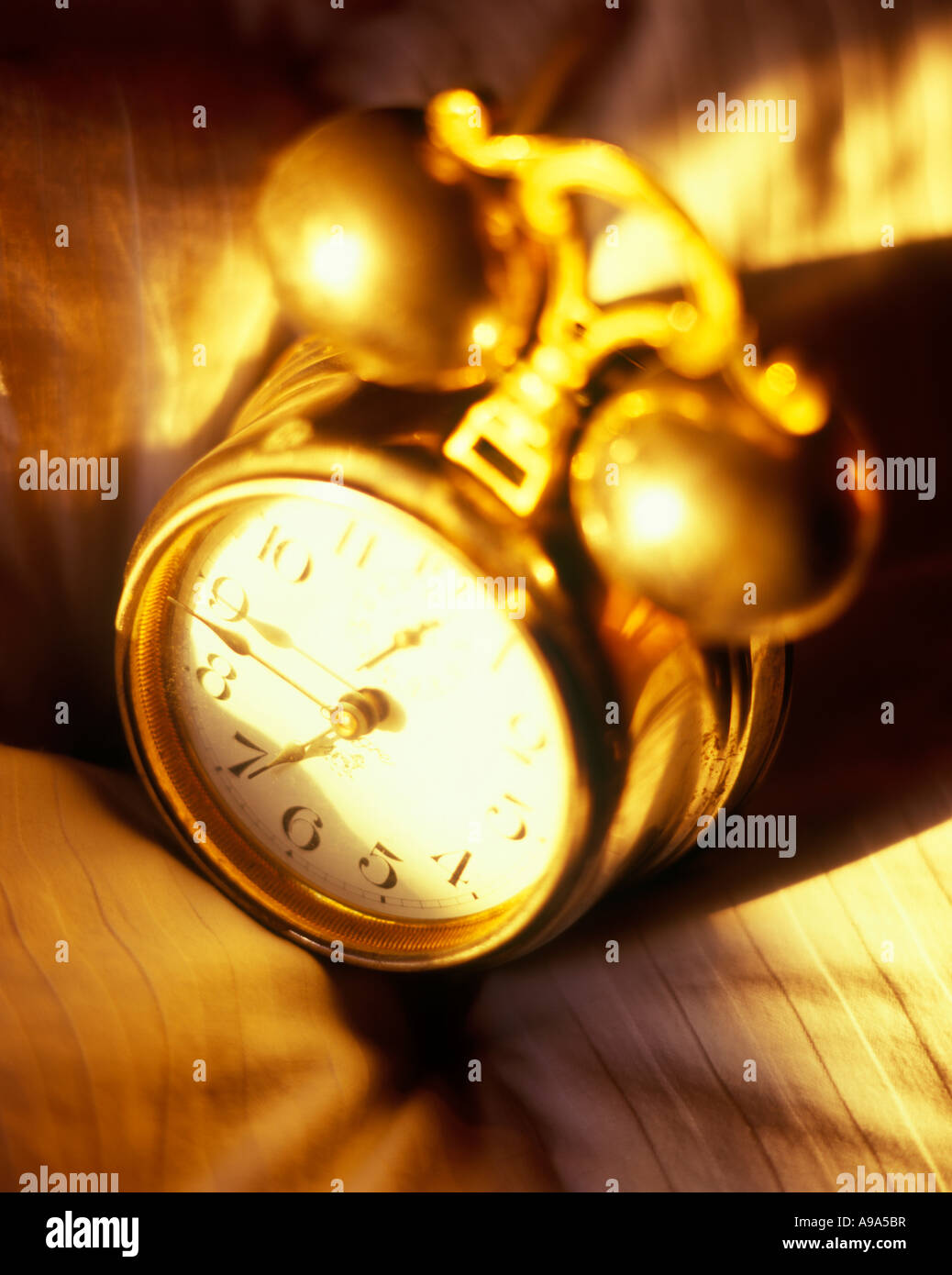 Classic Antique Old Fashioned Windup Alarm Clock Laying On Bed Stock Photo Alamy